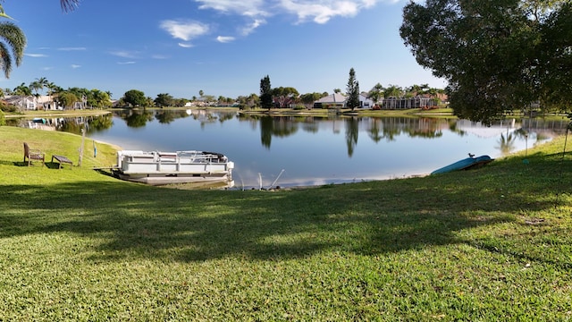 7040 Peninsula Court, Lake Court, Lake Worth, FL 33467 - mediterranean / spanish home with an attached garage, a front lawn, a tile roof, stucco siding, and concrete driveway