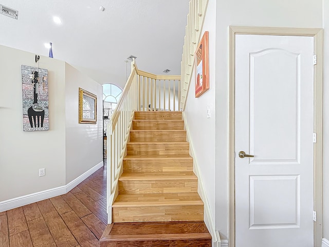 stairs with wood-type flooring