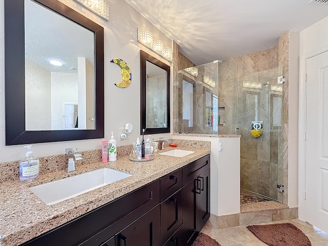 bathroom featuring an enclosed shower and vanity