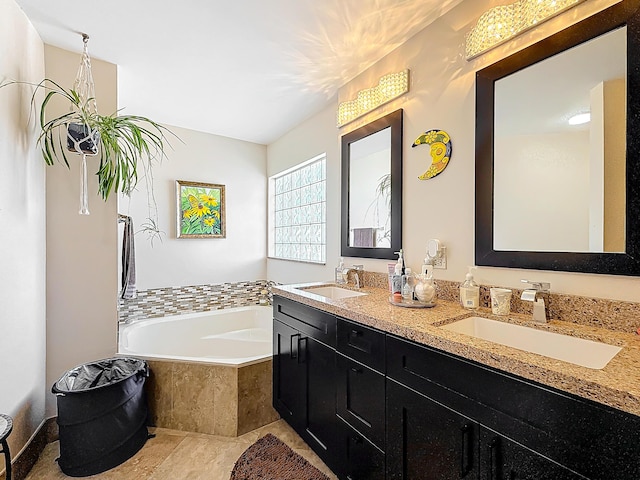 bathroom featuring vanity and tiled bath