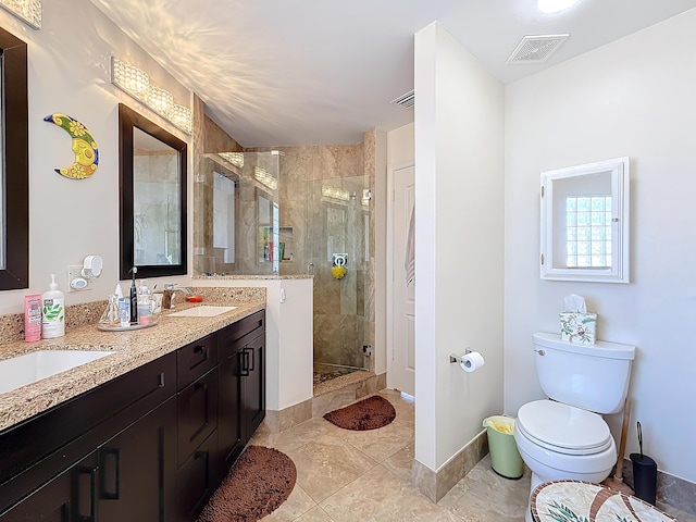 bathroom with an enclosed shower, vanity, and toilet