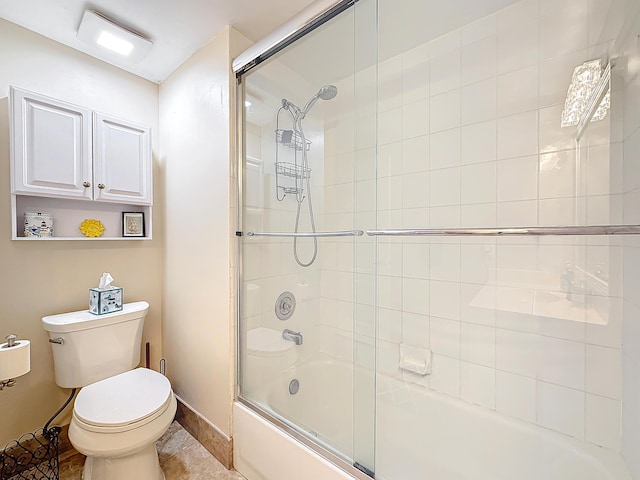 bathroom with tile patterned floors, enclosed tub / shower combo, and toilet