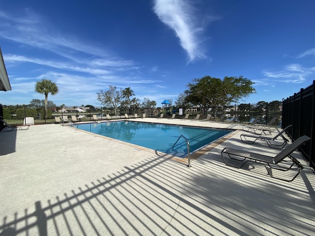 view of swimming pool featuring a patio