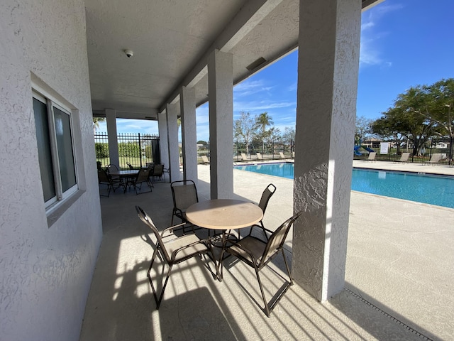 view of patio with a community pool