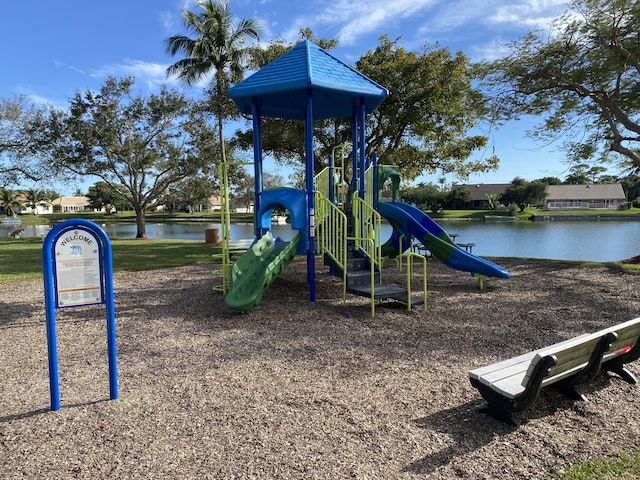 view of playground with a water view