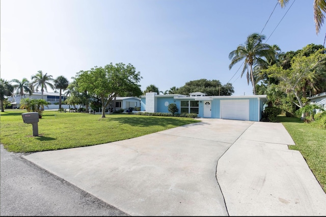 single story home with a garage and a front yard