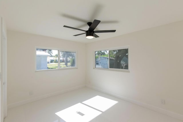 unfurnished room with ceiling fan