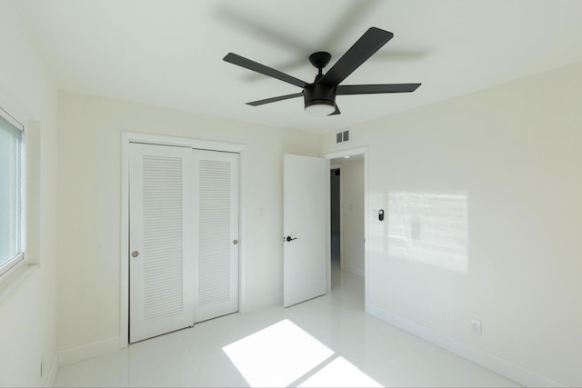 unfurnished bedroom featuring a closet and ceiling fan