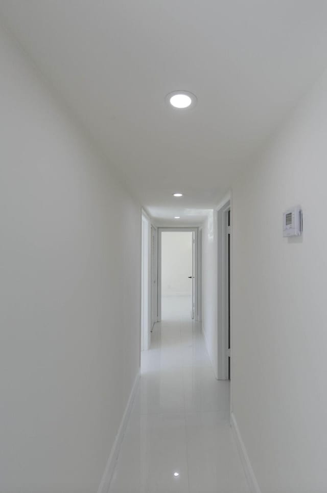 corridor featuring light tile patterned flooring