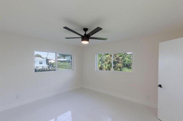 spare room with ceiling fan
