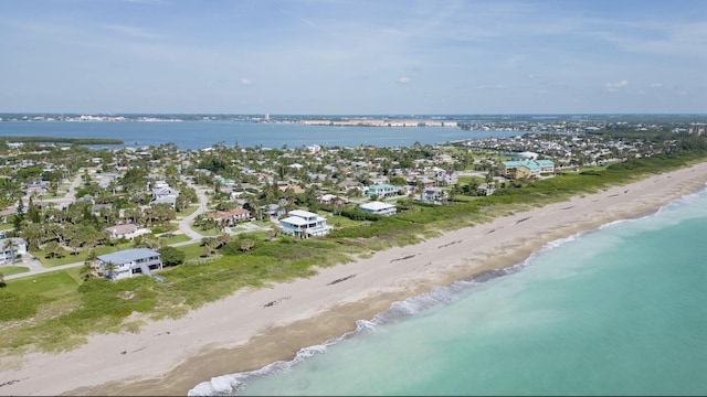 drone / aerial view with a view of the beach and a water view