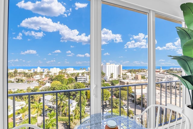 unfurnished sunroom featuring a water view