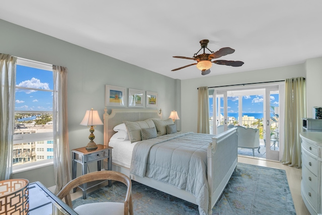 bedroom with access to exterior and ceiling fan