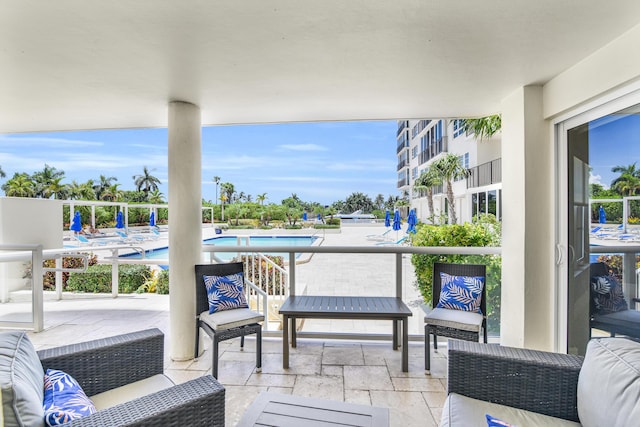 view of patio / terrace with outdoor lounge area and a community pool