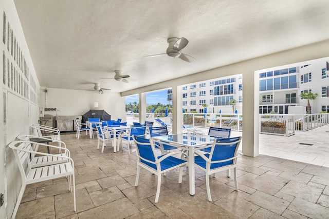 view of patio featuring ceiling fan