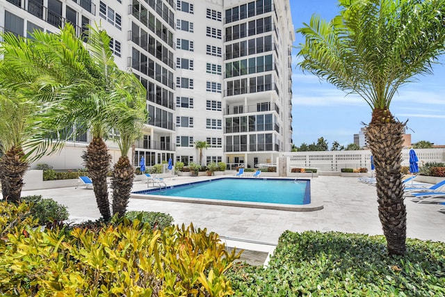 view of swimming pool with a patio area