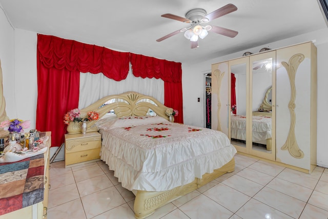 bedroom with a ceiling fan and tile patterned floors