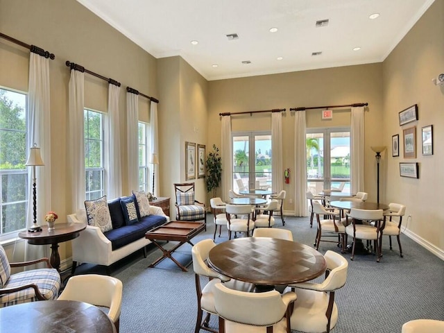 living room featuring crown molding and carpet flooring