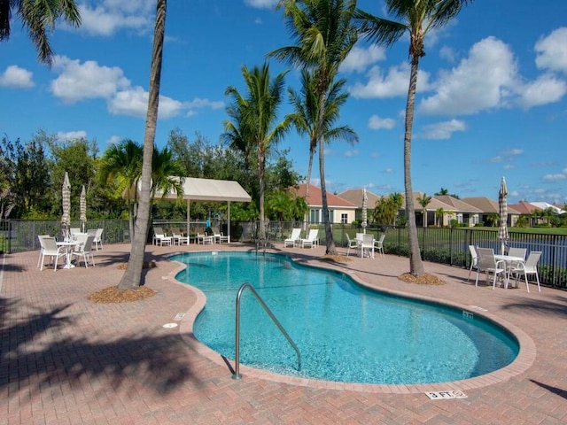 view of swimming pool with a patio area