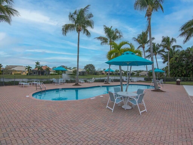 view of swimming pool with a patio