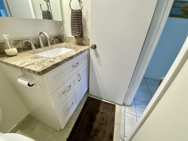 bathroom featuring vanity and tile patterned flooring