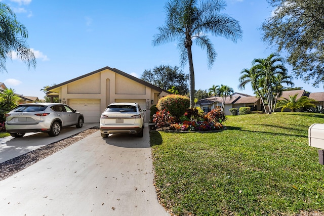 ranch-style home featuring a garage and a front yard