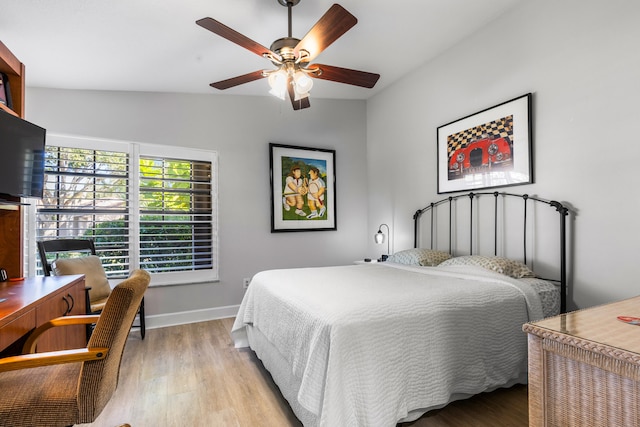 bedroom with light hardwood / wood-style flooring and ceiling fan