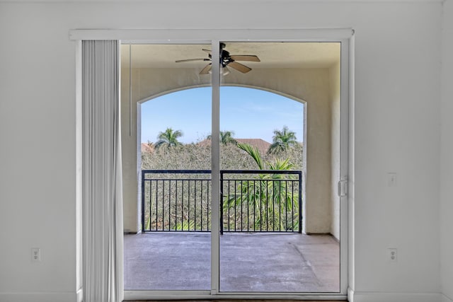 interior space with ceiling fan