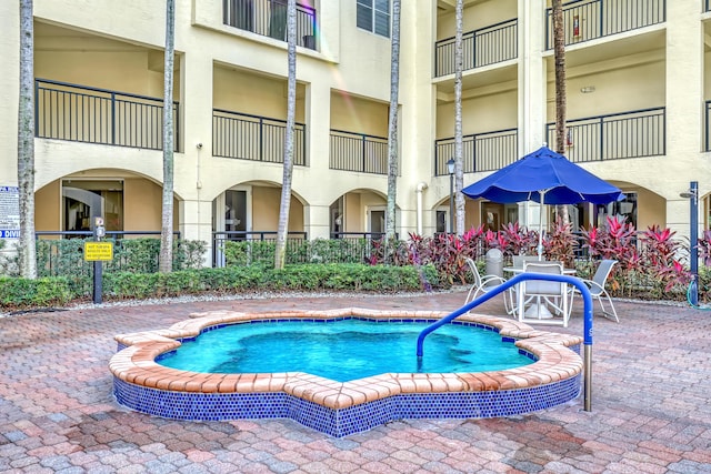 view of swimming pool with a patio area