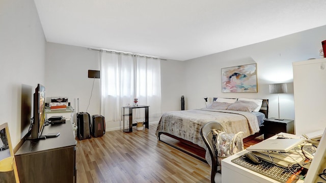 bedroom with light hardwood / wood-style flooring