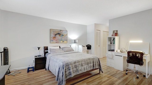 bedroom featuring a closet and light wood-type flooring