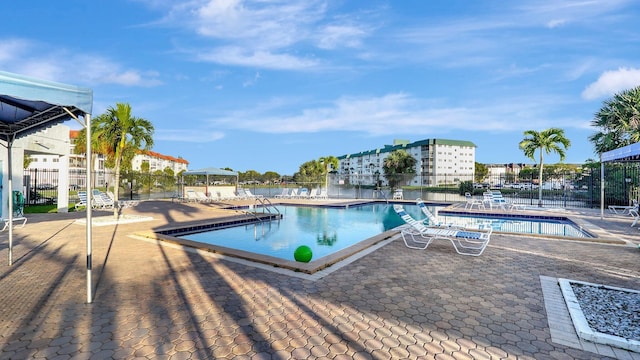4750 NW 22nd Ct Unit 118, Lauderhill, FL 33313 - shared laundry area featuring light tile patterned floors and washer and clothes dryer
