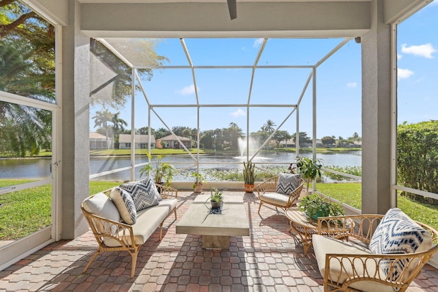 sunroom / solarium with a water view