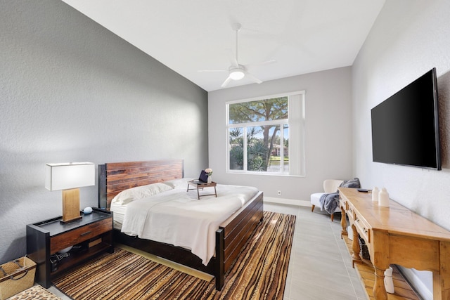 bedroom featuring lofted ceiling and ceiling fan