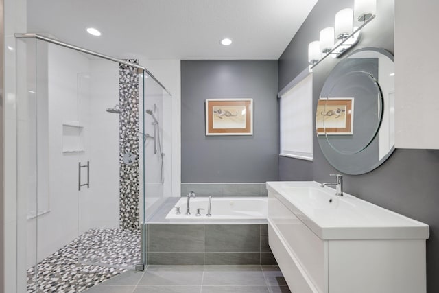 bathroom with vanity, tile patterned floors, and separate shower and tub