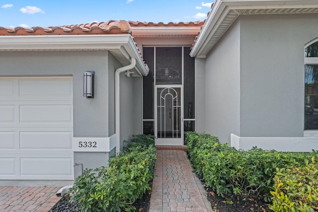 entrance to property featuring a garage