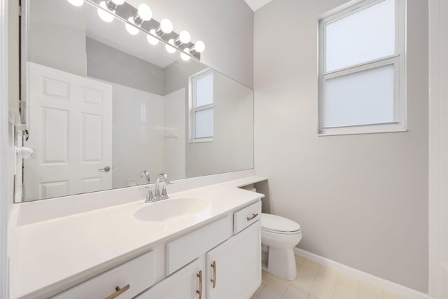 bathroom featuring vanity, a shower, and toilet