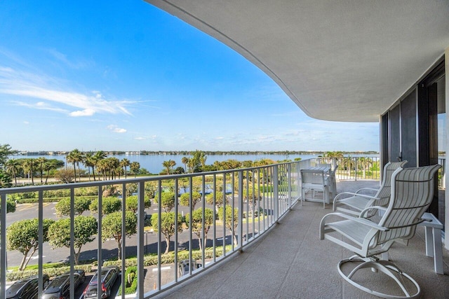 balcony featuring a water view