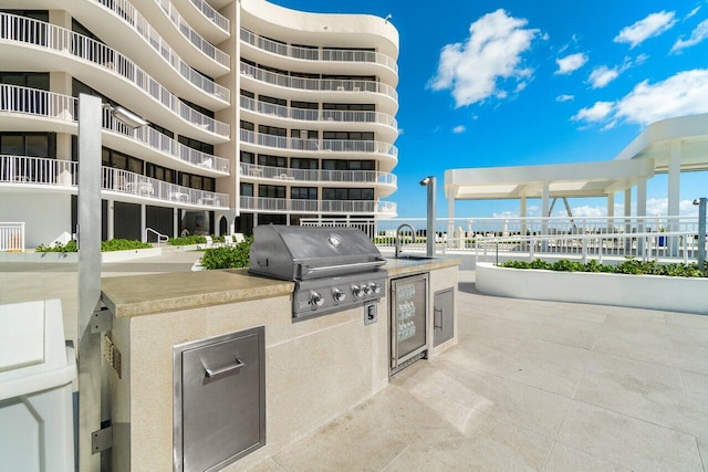 view of patio / terrace with area for grilling and a grill