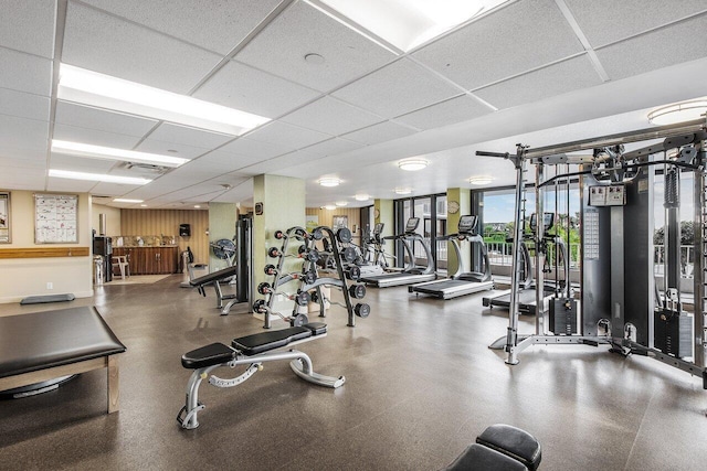 workout area with a paneled ceiling