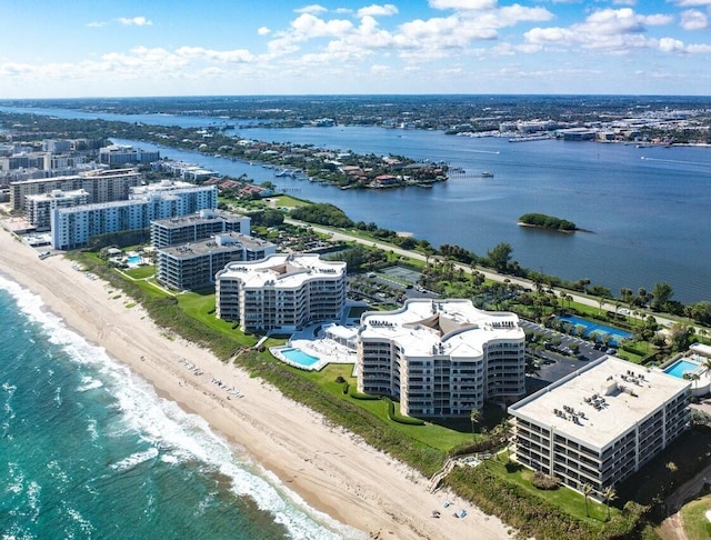 drone / aerial view with a water view and a view of the beach