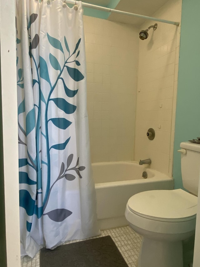 bathroom with shower / bath combination with curtain and toilet