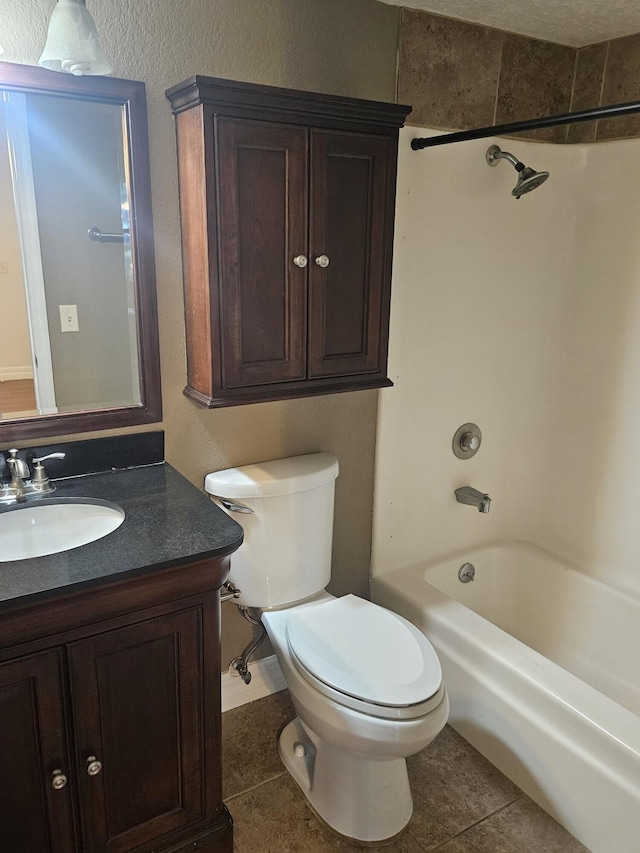 full bathroom featuring vanity, tile patterned flooring, bathing tub / shower combination, and toilet