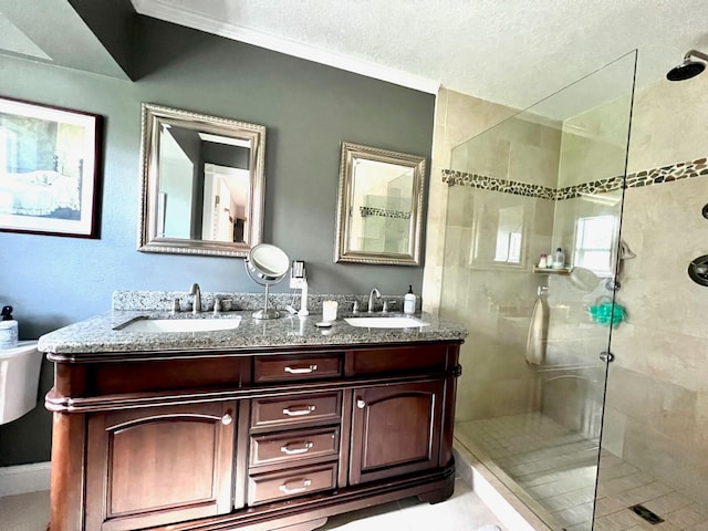 bathroom with vanity and a tile shower