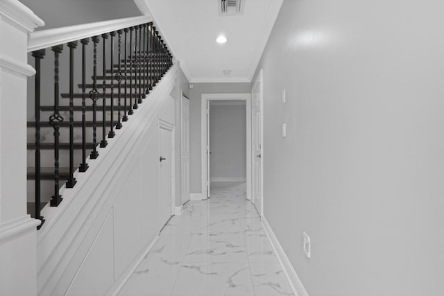 hallway featuring crown molding