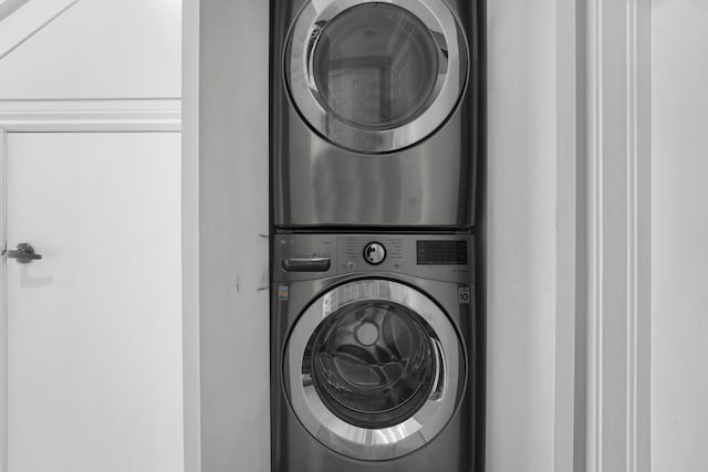 laundry area featuring stacked washer and clothes dryer