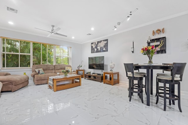 living room with ceiling fan and ornamental molding