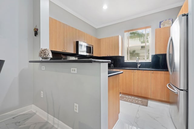 kitchen with sink, ornamental molding, appliances with stainless steel finishes, kitchen peninsula, and backsplash