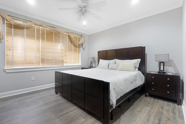 bedroom with ceiling fan and hardwood / wood-style floors