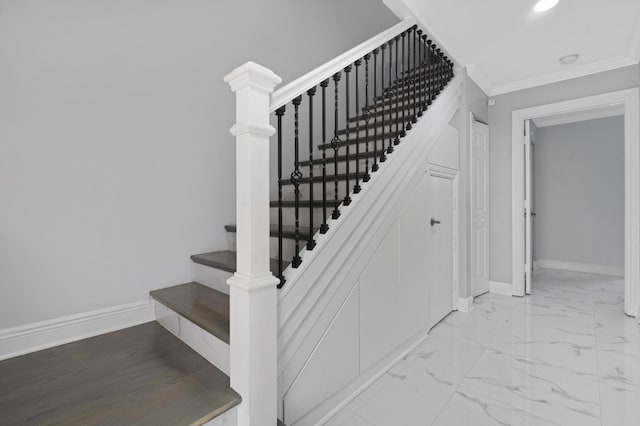 staircase featuring crown molding